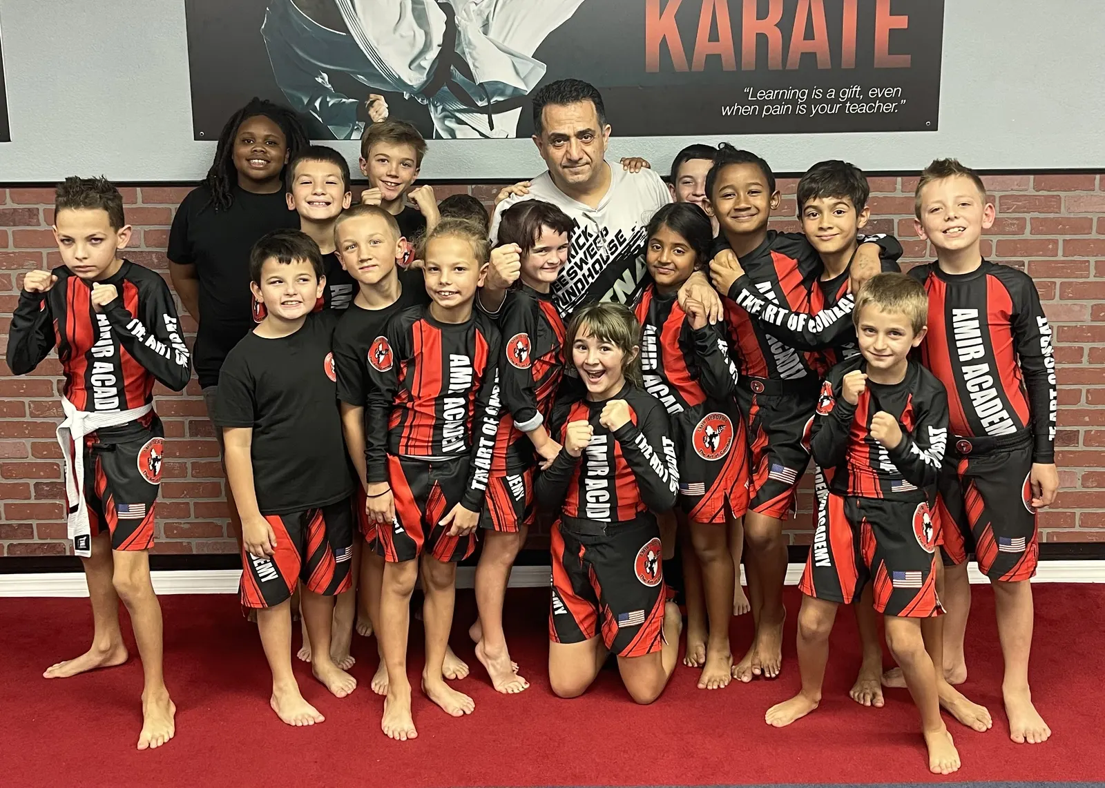Kids MMA class training striking and grappling fundamentals